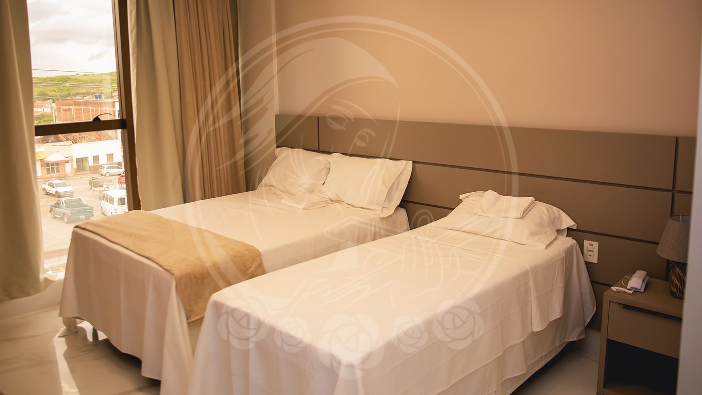 Quarto com duas camas de solteiro
